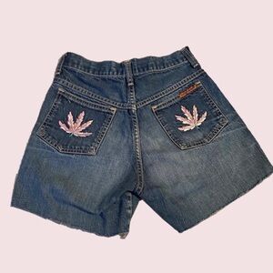 Vintage dark wash jean shorts with embroidered leaf